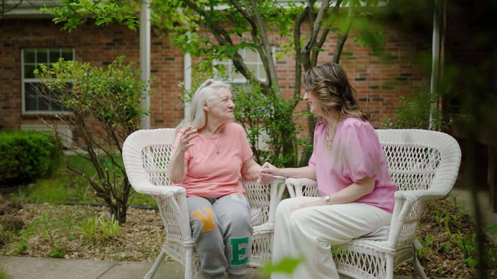 A woman talking to a staff worker with respite care